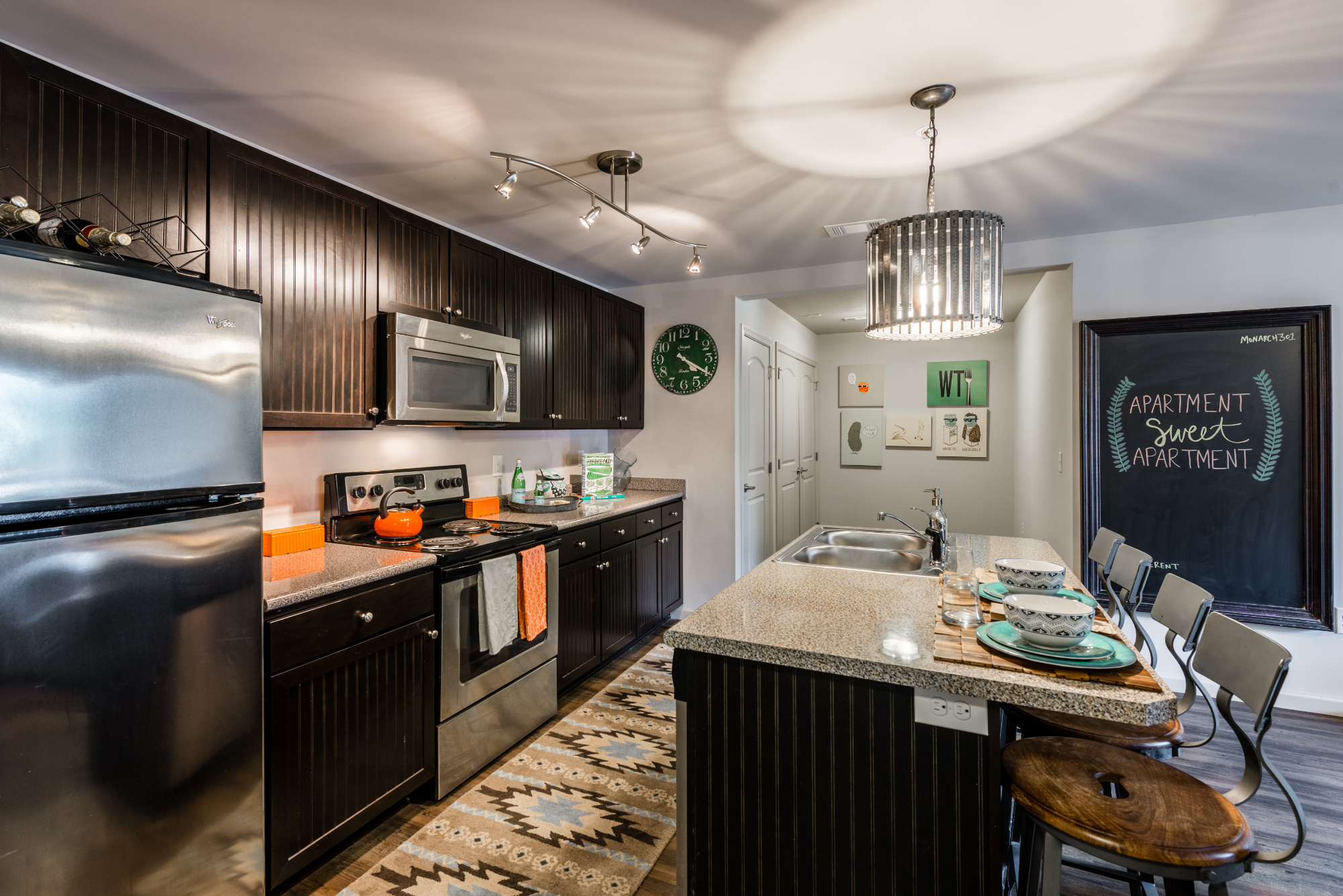 Kitchen with island seating at Monarch 301